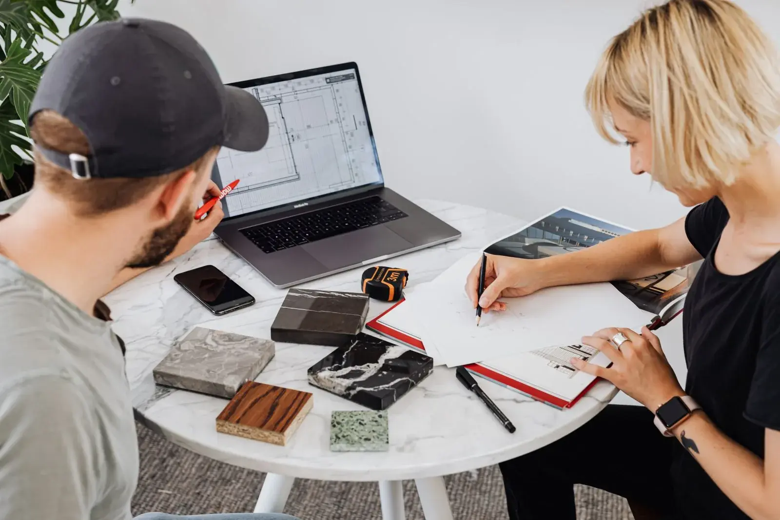Two designers reviewing plans and materials together
